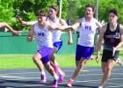 Making a clean handoff in the 400 meter relay, Gavyn Johnson gets the baton from Brek Wiese. They teamed up with Jace Martin and Madden Brabec to place second at the meet with a time of 44.13 seconds, narrowly missing out on a state meet qualifying spot. 
