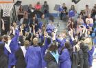 The latest crop of Shelton High School graduates take part in the age old tradition of tossing their caps in the air to celebrate their graduation after commencement ceremonies held last weekend at Shelton High School. (–photo by Steve Glenn) Tassels turned in SHS ceremony