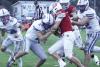 Gibbon’s Riley Bergstrom puts his shoulder into the Amherst ball carrier for a tackle as teammates Lukas Altwine (#24) and Adan Tamayo converge to help. (—photo by Alissa Baxter)