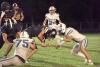 Gibbon’s Tyler Hodges (#75) gets an Elm Creek ball carrier’s leg wrapped up, while teammate Ivan Tamayo uses his shoulder to stop forward motion, during last Friday night’s football contest. (—photo by Alissa Baxter)